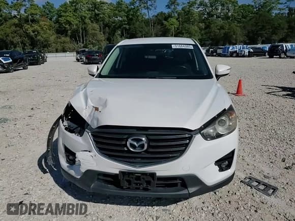 ✅ 2016 Mazda CX-5 Touring • VIN: JM3KE2CY2G0607428 • Лот: 91684385. Опубликован ранее на Copart с пробегом 130 111 миль. Бесплатный доступ к архиву аукционных продаж из США и подробный отчёт об истории автомобиля на DreamBid. Изображение 14.