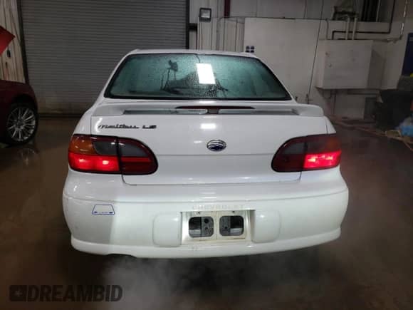 2003 Chevrolet Malibu LS with VIN 1G1NE52J93M548014, listed as a Copart auction lot 85445814 with 114,160 mi miles and Salvage title. Bid and sale history available at DreamBid. Image 6.