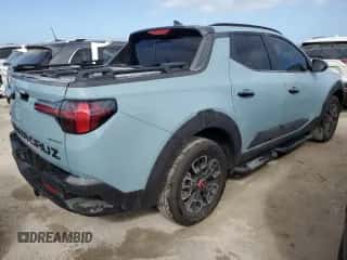 2024 Hyundai Santa Cruz XRT z VIN 5NTJDDDF9RH116121, wystawiony jako Copart lot #76419174 z przebiegiem 1 843 mil mil oraz Szkoda całkowita • Salvage title. Historia ofert i sprzedaży dostępna na DreamBid. Obrazek 3.