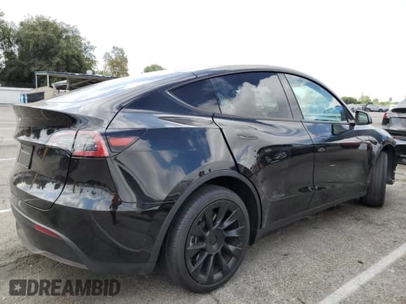 ✅ 2023 Tesla Model Y • VIN: 7SAYGDED1PF941165 • Lot: 71301845. Listed on Copart with 18,142 mi. Free auction sales archive from the USA and detailed vehicle history report at DreamBid. Image 3.