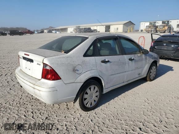 ✅ 2005 Ford Focus S • VIN: 1FAFP34N05W169006 • Lot: 92454825. Listed on Copart with Not provided. Free auction sales archive from the USA and detailed vehicle history report at DreamBid. Image 3.