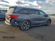 ✅ 2018 Honda Odyssey Touring • VIN: 5FNRL6H85JB029556 • Лот: 94162165. Опубликован ранее на Copart с пробегом 186 037 миль. Бесплатный доступ к архиву аукционных продаж из США и подробный отчёт об истории автомобиля на DreamBid. Изображение 3.
