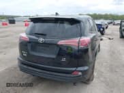 ✅ 2018 Toyota RAV4 LE • VIN: 2T3BFREVXJW763690 • Lot: 42171331. Listed on IAAI with 133,428 mi. Free auction sales archive from the USA and detailed vehicle history report at DreamBid. Image 4.