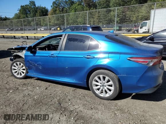 2019 Toyota Camry LE z VIN 4T1B11HK7KU264700, wystawiony jako Copart lot #85474625 z przebiegiem 128 420 mil mil oraz Szkoda całkowita • Salvage title. Historia ofert i sprzedaży dostępna na DreamBid. Obrazek 2.