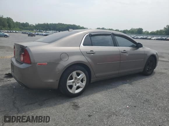 ✅ 2012 Chevrolet Malibu 1LS • VIN: 1G1ZB5E05CF316317 • Lot: 59702495. Listed on Copart with 137,824 mi. Free auction sales archive from the USA and detailed vehicle history report at DreamBid. Image 3.