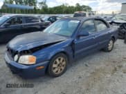 ✅ 2003 Kia Optima LX • VIN: KNAGD128135213278 • Lot: 55348075. Wystawiony na Copart z przebiegiem 165 769 mil. Bezpłatny archiwum sprzedaży aukcyjnych z USA i szczegółowy raport historii pojazdu na DreamBid. Zdjęcie 1.