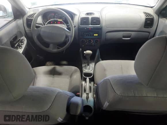 2005 Hyundai Accent GLS z VIN KMHCG45C15U602419, wystawiony jako Copart lot #47759675 z przebiegiem 58 133 mil mil oraz Szkoda całkowita • Salvage title. Historia ofert i sprzedaży dostępna na DreamBid. Obrazek 8.