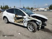 ✅ 2023 Tesla Model Y Long Range • VIN: 7SAYGDEE5PA036191 • Lot: 65167315. Listed on Copart with 30,462 mi. Free auction sales archive from the USA and detailed vehicle history report at DreamBid. Image 4.