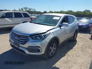 2018 Hyundai Santa Fe 2.4L z VIN 5XYZT3LB5JG563330, wystawiony jako IAAI lot #43397944 z przebiegiem 124 663 mil mil oraz . Historia ofert i sprzedaży dostępna na DreamBid. Obrazek 2.