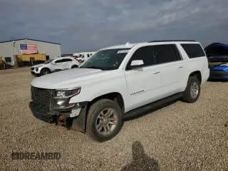 ✅ 2020 Chevrolet Suburban LT • VIN: 1GNSCHKC5LR119885 • Lot: 82712425. Listed on Copart with 220,324 mi. Free auction sales archive from the USA and detailed vehicle history report at DreamBid. Image 1.