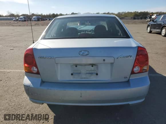 2003 Hyundai Accent GL z VIN KMHCG45C23U428132, wystawiony jako Copart lot #45493875 z przebiegiem Nie podano mil oraz Szkoda całkowita • Salvage title. Historia ofert i sprzedaży dostępna na DreamBid. Obrazek 6.