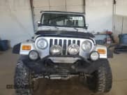 ✅ 2004 Jeep Wrangler Rubicon • VIN: 1J4FA69S14P758371 • Lot: 85557875. Wystawiony na Copart z przebiegiem 144 656 mil. Bezpłatny archiwum sprzedaży aukcyjnych z USA i szczegółowy raport historii pojazdu na DreamBid. Zdjęcie 5.