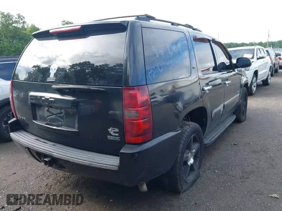 2011 Chevrolet Tahoe LTZ with VIN 1GNSKCE05BR169305, listed as a IAAI auction lot 42247417 with 214,713 mi miles and . Bid and sale history available at DreamBid. Image 4.