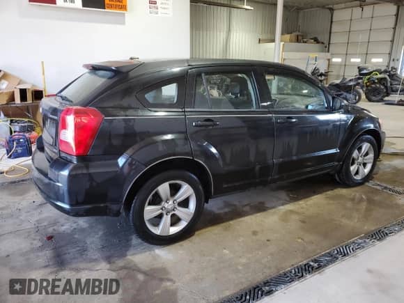 2010 Dodge Caliber SXT z VIN 1B3CB4HA3AD552566, wystawiony jako Copart lot #77544244 z przebiegiem 148 850 mil mil oraz Szkoda całkowita • Salvage title. Historia ofert i sprzedaży dostępna na DreamBid. Obrazek 3.
