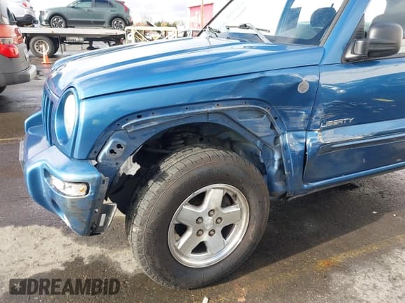 ✅ 2004 Jeep Liberty Limited • VIN: 1J4GL58KX4W232319 • Lot: 40870366. Listed on IAAI with 226,249 mi. Free auction sales archive from the USA and detailed vehicle history report at DreamBid. Image 6.
