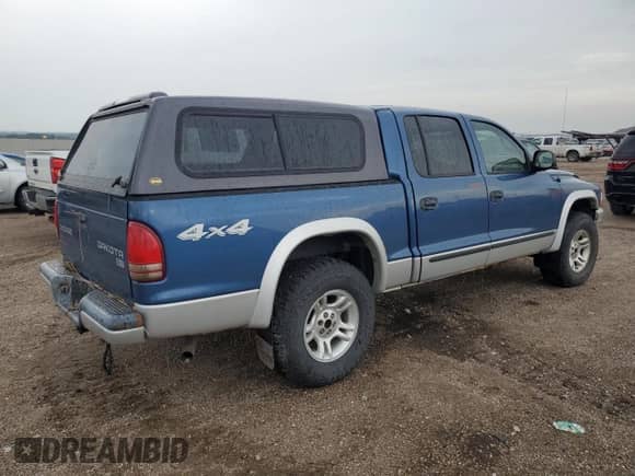 2004 Dodge Dakota SLT z VIN 1D7HG48N04S695750, wystawiony jako Copart lot #61059154 z przebiegiem Nie podano mil oraz Szkoda całkowita • Salvage title. Historia ofert i sprzedaży dostępna na DreamBid. Obrazek 3.