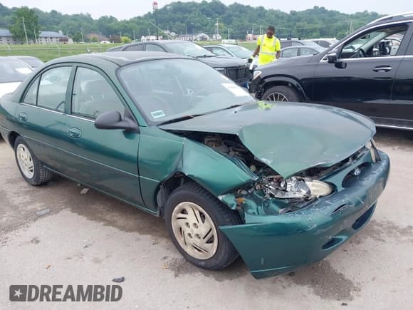 ✅ 1999 Ford Escort LX • VIN: 1FAFP10P1XW230023 • Lot: 42486934. Listed on IAAI with 41,468 mi. Free auction sales archive from the USA and detailed vehicle history report at DreamBid. Image 1.