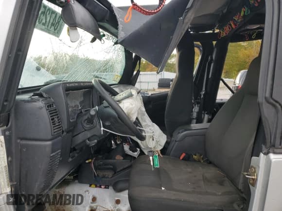 ✅ 2006 Jeep Wrangler X • VIN: 1J4FA39S46P719713 • Lot: 84725805. Listed on Copart with 124,267 mi. Free auction sales archive from the USA and detailed vehicle history report at DreamBid. Image 7.