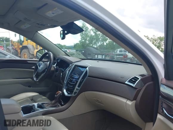 ✅ 2014 Cadillac SRX Performance Collection • VIN: 3GYFNCE35ES561742 • Lot: 42579887. Listed on IAAI with 95,009 mi. Free auction sales archive from the USA and detailed vehicle history report at DreamBid. Image 5.