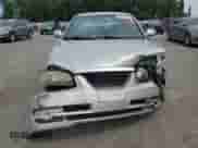 2005 Hyundai Elantra GLS z VIN KMHDN46D15U157116, wystawiony jako Copart lot #68161604 z przebiegiem 140 177 mil mil oraz Szkoda całkowita • Salvage title. Historia ofert i sprzedaży dostępna na DreamBid. Obrazek 5.