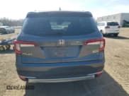 ✅ 2022 Honda Pilot Touring 7-Passenger • VIN: 5FNYF6H61NB504935 • Lot: 51186805. Listed on Copart with 99,373 mi. Free auction sales archive from the USA and detailed vehicle history report at DreamBid. Image 6.