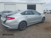 ✅ 2017 Ford Fusion Hybrid Titanium • VIN: 3FA6P0RU3HR188204 • Лот: 42618604. Опубликован ранее на IAAI с пробегом 104 609 миль. Бесплатный доступ к архиву аукционных продаж из США и подробный отчёт об истории автомобиля на DreamBid. Изображение 4.