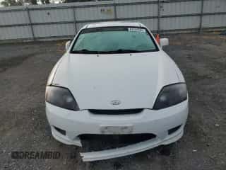 ✅ 2005 Hyundai Tiburon GS • VIN: KMHHM65D35U184724 • Лот: 84444495. Опубликован ранее на Copart с пробегом 203 238 миль. Бесплатный доступ к архиву аукционных продаж из США и подробный отчёт об истории автомобиля на DreamBid. Изображение 5.