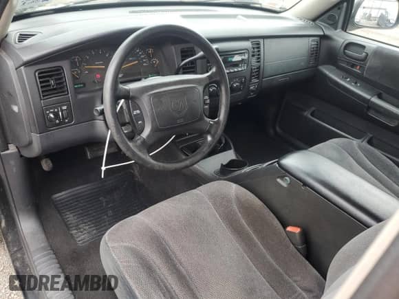 2001 Dodge Dakota Sport z VIN 1B7GG22N01S129747, wystawiony jako Copart lot #74132454 z przebiegiem 180 890 mil mil oraz Szkoda całkowita • Salvage title. Historia ofert i sprzedaży dostępna na DreamBid. Obrazek 8.