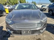 ✅ 2017 Ford Fusion Hybrid Titanium • VIN: 3FA6P0RUXHR260967 • Lot: 90726665. Wystawiony na Copart z przebiegiem 250 880 mil. Bezpłatny archiwum sprzedaży aukcyjnych z USA i szczegółowy raport historii pojazdu na DreamBid. Zdjęcie 5.