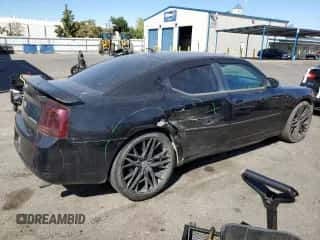 2010 Dodge Charger SXT with VIN 2B3CA3CV9AH210274, listed as a Copart auction lot 74743934 with 182,675 mi miles and Salvage title. Bid and sale history available at DreamBid. Image 3.