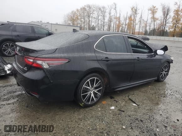 ✅ 2022 Toyota Camry Hybrid Nightshade • VIN: 4T1G31AK2NU576504 • Лот: 91945085. Опубликован ранее на Copart с пробегом 159 295 миль. Бесплатный доступ к архиву аукционных продаж из США и подробный отчёт об истории автомобиля на DreamBid. Изображение 3.