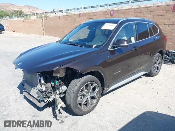 ✅ 2018 BMW X1 sDrive28i • VIN: WBXHU7C37J5L05511 • Lot: 42980003. Listed on IAAI with 25,925 mi. Free auction sales archive from the USA and detailed vehicle history report at DreamBid. Image 2.