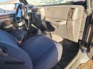 ✅ 2000 Jeep Wrangler Sport • VIN: 1J4FA49S9YP738234 • Lot: 91114555. Listed on Copart with 245,066 mi. Free auction sales archive from the USA and detailed vehicle history report at DreamBid. Image 8.