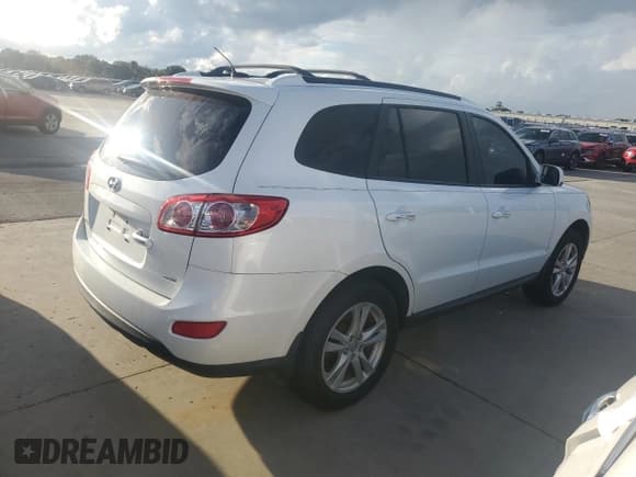 ✅ 2012 Hyundai Santa Fe Limited • VIN: 5XYZK4AG0CG104670 • Lot: 74339274. Listed on Copart with 69,102 mi. Free auction sales archive from the USA and detailed vehicle history report at DreamBid. Image 3.