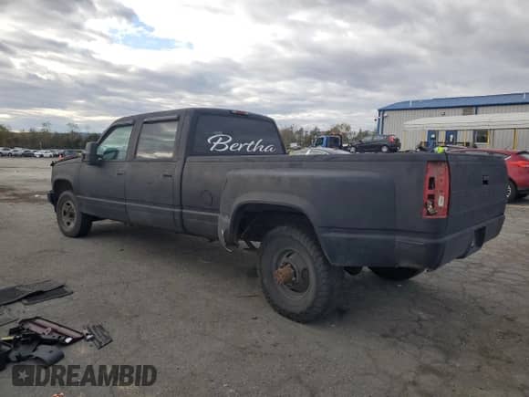 1997 Chevrolet Silverado 3500 with VIN 1GCHC33J3VF052789, listed as a Copart auction lot 86842835 with 137,985 mi miles and Salvage title. Bid and sale history available at DreamBid. Image 2.