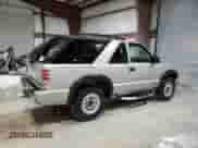 2000 Chevrolet Blazer LS z VIN 1GNCT18W9YK188091, wystawiony jako Copart lot #78592844 z przebiegiem 69 497 mil mil oraz Szkoda całkowita • Salvage title. Historia ofert i sprzedaży dostępna na DreamBid. Obrazek 3.