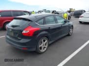 ✅ 2014 Ford Focus Titanium • VIN: 1FADP3N27EL114825 • Lot: 43217005. Listed on IAAI with 148,002 mi. Free auction sales archive from the USA and detailed vehicle history report at DreamBid. Image 4.