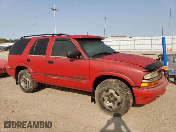2003 Chevrolet Blazer LS z VIN 1GNDT13X83K135413, wystawiony jako Copart lot #71185894 z przebiegiem Nie podano mil oraz Szkoda całkowita • Salvage title. Historia ofert i sprzedaży dostępna na DreamBid. Obrazek 4.