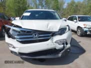 ✅ 2018 Honda Pilot EX-L • VIN: 5FNYF6H57JB045332 • Lot: 42064344. Listed on IAAI with 140,129 mi. Free auction sales archive from the USA and detailed vehicle history report at DreamBid. Image 13.