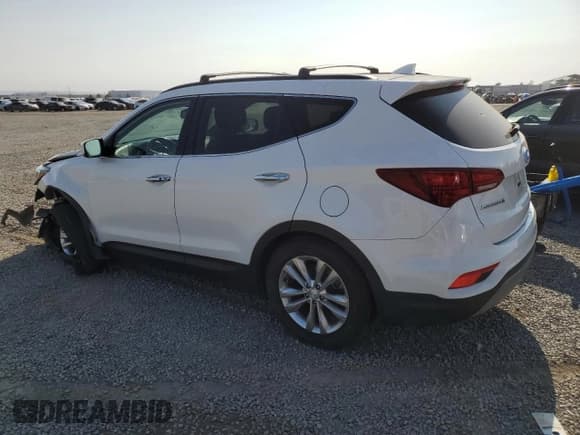 ✅ 2018 Hyundai Santa Fe 2.0T • VIN: 5XYZU4LA0JG554836 • Лот: 65013984. Опубликован ранее на Copart с пробегом 102 398 миль. Бесплатный доступ к архиву аукционных продаж из США и подробный отчёт об истории автомобиля на DreamBid. Изображение 2.