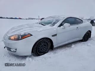 ✅ 2007 Hyundai Tiburon GT • VIN: KMHHN65F57U247209 • Лот: 85445885. Опубликован ранее на Copart с пробегом 137 418 миль. Бесплатный доступ к архиву аукционных продаж из США и подробный отчёт об истории автомобиля на DreamBid. Изображение 1.