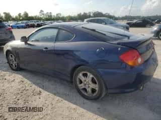 2003 Hyundai Tiburon z VIN KMHHM65D03U095741, wystawiony jako Copart lot #55147305 z przebiegiem 170 946 mil mil oraz Szkoda całkowita • Salvage title. Historia ofert i sprzedaży dostępna na DreamBid. Obrazek 2.