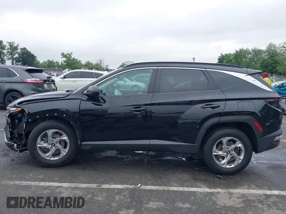✅ 2022 Hyundai Tucson SEL • VIN: KM8JBCAE6NU031615 • Lot: 42887395. Listed on IAAI with 63,078 mi. Free auction sales archive from the USA and detailed vehicle history report at DreamBid. Image 14.