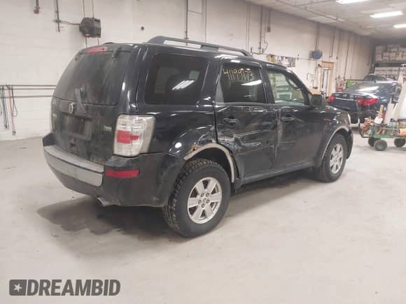 2010 Mercury Mariner with VIN 4M2CN9BG0AKJ06493, listed as a IAAI auction lot 41199173 with 143,631 mi miles and . Bid and sale history available at DreamBid. Image 4.