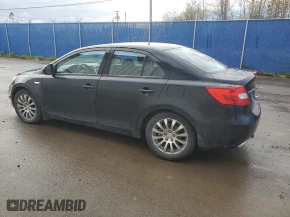 ✅ 2012 Suzuki Kizashi SE • VIN: JS2RF9A32C6100580 • Лот: 91204895. Опубликован ранее на Copart с пробегом 173 714 миль. Бесплатный доступ к архиву аукционных продаж из США и подробный отчёт об истории автомобиля на DreamBid. Изображение 2.