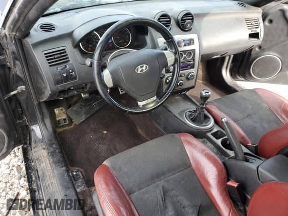 2007 Hyundai Tiburon GT с VIN KMHHN66F87U252127, выставлен на аукционе Copart как лот 43349365 с пробегом 186 319 миль миль и Чистый • Clean title. История ставок и продаж доступна на DreamBid. Изображение 8.