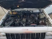 ✅ 1990 Jeep Cherokee Laredo • VIN: 1J4FJ58L2LL115246 • Lot: 69425394. Wystawiony na Copart z przebiegiem 122 452 mil. Bezpłatny archiwum sprzedaży aukcyjnych z USA i szczegółowy raport historii pojazdu na DreamBid. Zdjęcie 13.