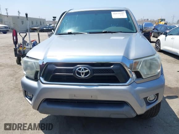 ✅ 2015 Toyota Tacoma PreRunner • VIN: 3TMKU4HN9FM045948 • Lot: 42575327. Listed on IAAI with 67,971 mi. Free auction sales archive from the USA and detailed vehicle history report at DreamBid. Image 12.