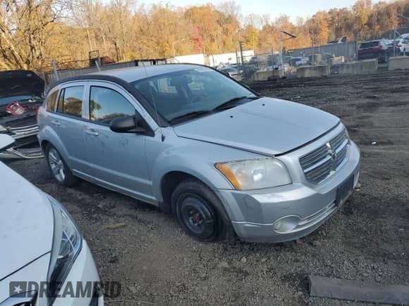 2011 Dodge Caliber Mainstreet with VIN 1B3CB3HA3BD123701, listed as a Copart auction lot 90858485 with 172,631 mi miles and Salvage title. Bid and sale history available at DreamBid. Image 4.