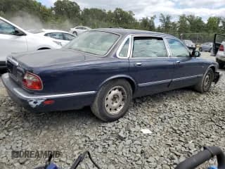 ✅ 2000 Jaguar XJ Vanden Plas • VIN: SAJDA24CXYLF13463 • Лот: 67797454. Опубликован ранее на Copart с пробегом 144 765 миль. Бесплатный доступ к архиву аукционных продаж из США и подробный отчёт об истории автомобиля на DreamBid. Изображение 3.